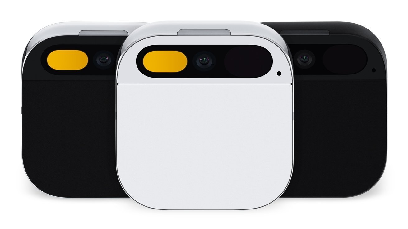 Tres dispositivos de cámara compactos, cuadrados y redondeados, frontales y con un diseño minimalista; La unidad blanca en el medio está flanqueada por dos unidades negras, cada una con una cámara ancha en forma de píldora e iluminación decorativa amarilla.